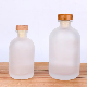  Wholesale 100ml 250ml 375ml 500ml Round Clear Frosted Glass Bottle with Wood Stopper for Water Wine Juice Liquor