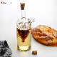  Customized Clear Borosolicate Glass Olive Oil Vinegar Glass Bottle Grape Liner Design Two Spout Oil Bottle