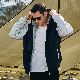 Wholesaler Men Polyester Warm Soft Shell Knitted Sleeve Quilted Jacket Cotton-Padded Jacket