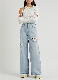  ODM Women′ S Fashion Flared Jeans Lady′ S Light Blue Ripped Hole Denim Pants Wholesales